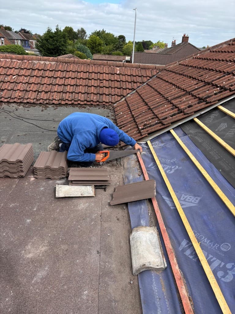 Full domestic re-roof in progress with scaffold and skip in Accrington by Holgates Roofing