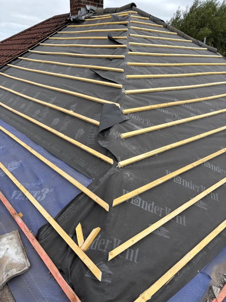 Hip roof with breathable membrane and battens before tiling in Accrington by Holgates Roofing